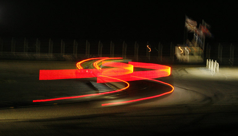 Sebring Race Gallery: A competitor speeds through turn 15 at night