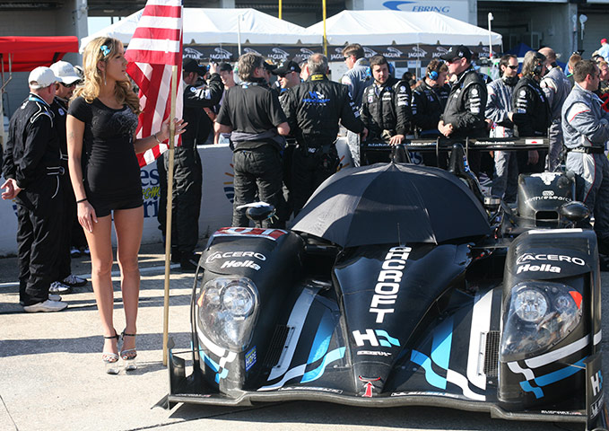 Sebring Race Gallery: A grid girl stands next to the Highcroft car