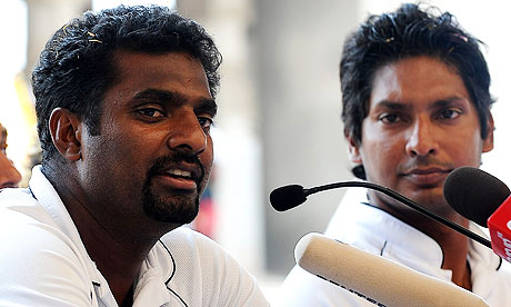 Muttiah Muralitharan speaks during a press conference as Sri Lanka captain Kumar Sangakkara looks on