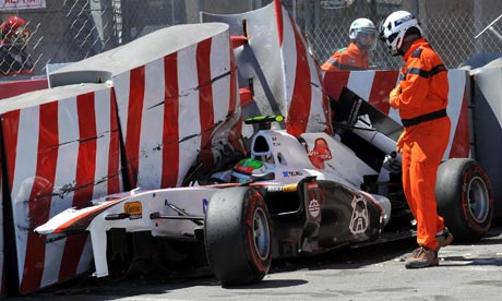 Sauber's Sergio P rez remains in his car after crashing during qualifying