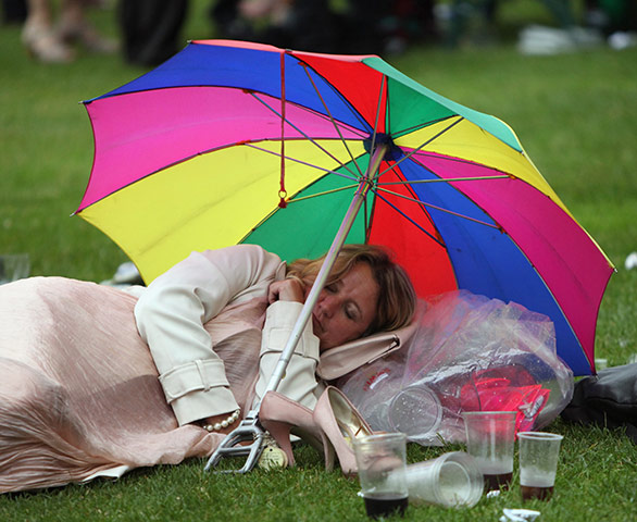 Royal Ascot Day 2: A woman sleeps on the ground after racing on day two of Royal Ascot 
