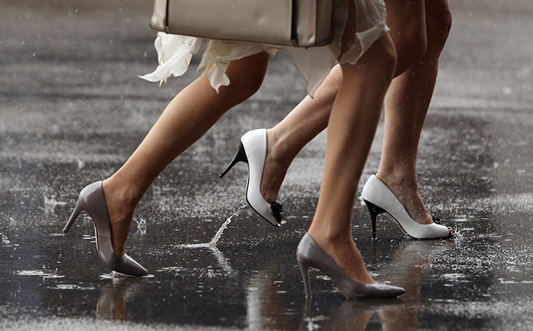 Ascot Ladies day: Wet racegoers attend Ladies Day at Royal Ascot