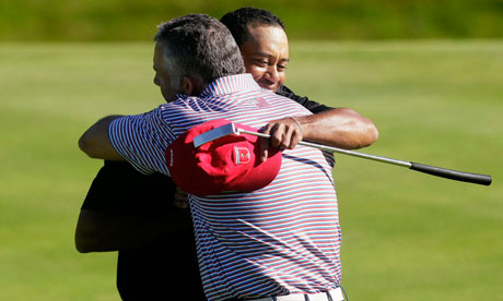 Tiger Woods and former caddie Steve Williams embrace at last year's Ryder Cup