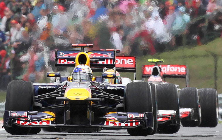 Red Bull's Sebastian Vettel leads Lewis Hamiltonand Jenson Button at the Hungary Grand Prix