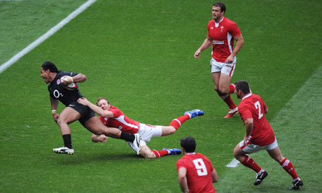 England's Manu Tuilagi breaks through the Wales defence to score his side's second try