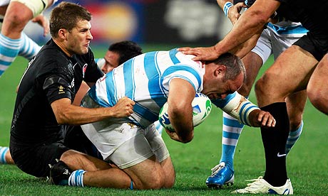 Richard Wigglesworth, left, tackles Argentina's Rodrigo Roncero during their World Cup opener