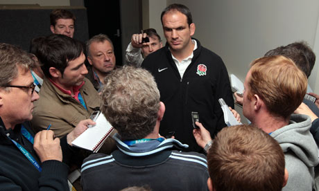 Martin Johnson, the England manager, talks to the press in Dunedin.