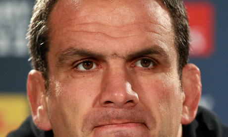 England's coach Martin Johnson gestures during a news conference after the captain's run in Dunedin