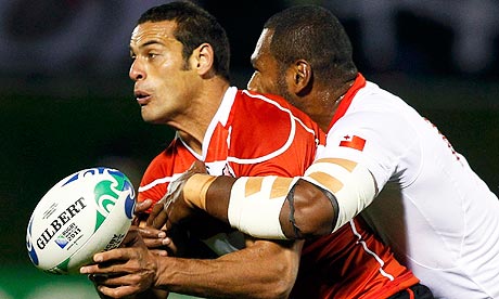 Tonga's Alipate Fatafehi tackles Japan's Ryan Nicholas