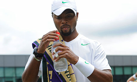 Donald Young has a drink in his match against Alex Bogomolov Jr at Wimbledon