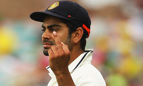 Virat Kohli gestures to fans at the SCG