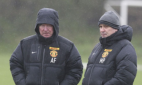 Manchester United's Sir Alex Ferguson and Mike Phelan