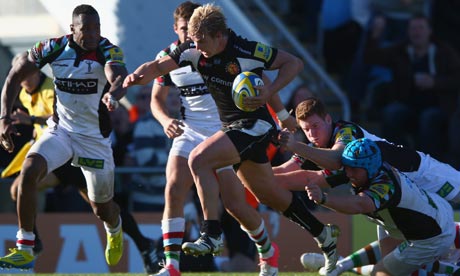 Jason Shoemark, centre, of Exeter scores a try against Harlequins in the Aviva Premiership