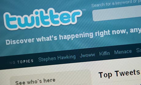The Twitter homepage appears on a screen