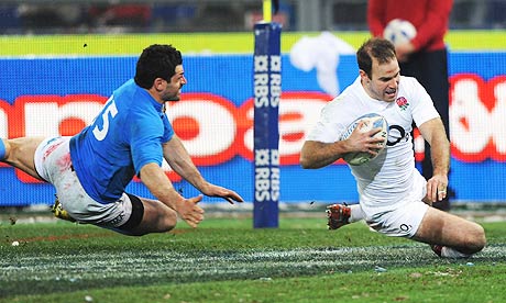 England's Charlie Hodgson eludes Andrea Masi of Italy to score a try in the Six Nation