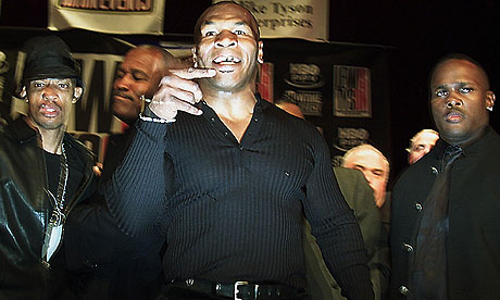 Mike Tyson shouts at reporters after a brawl broke out with Lennox Lewis in New York in 2002