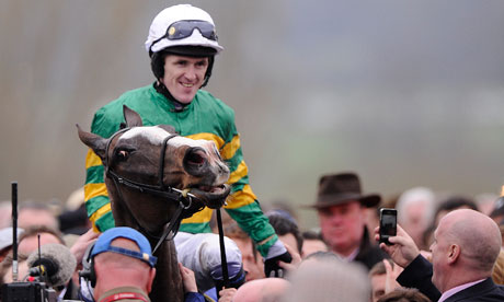 A happy Tony McCoy on Synchronised try to get in to the winners enclosure after their victory