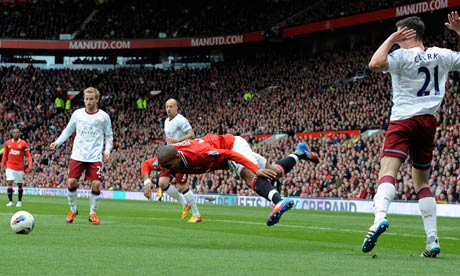 Ashley Young falls dramatically