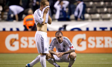 Vancouver Whitecaps' Eric Hassli and Jordan Harvey