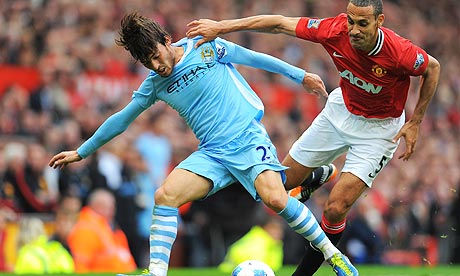 David Silva, left, tussels with Rio Ferdiand during Manchester City's 6-1 win against United