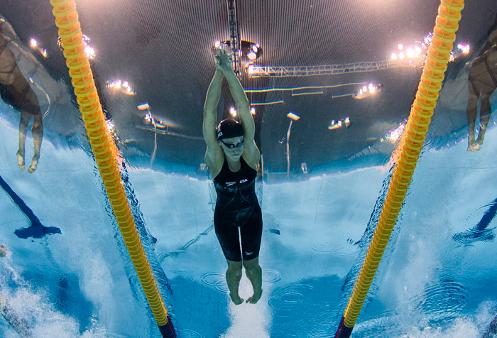 Dana Vollmer, centre, powers to 100m butterfly gold