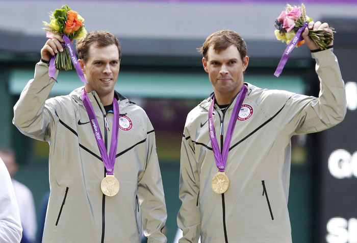 Mike Bryan and Bob Bryan enjoy their men's doubles tennis win at Wimbledon