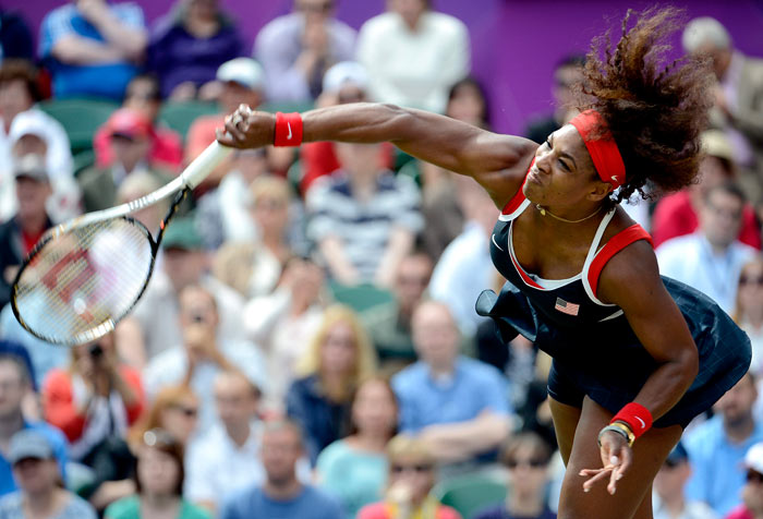 Serena Williams serves during her singles final victory over Maria Sharapova of Russia