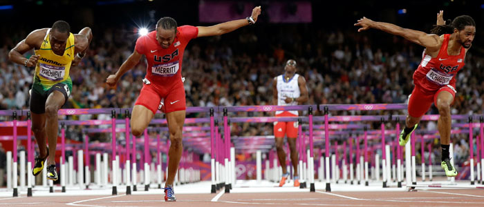 Aries Merritt, second left, wins the 110m hurdles