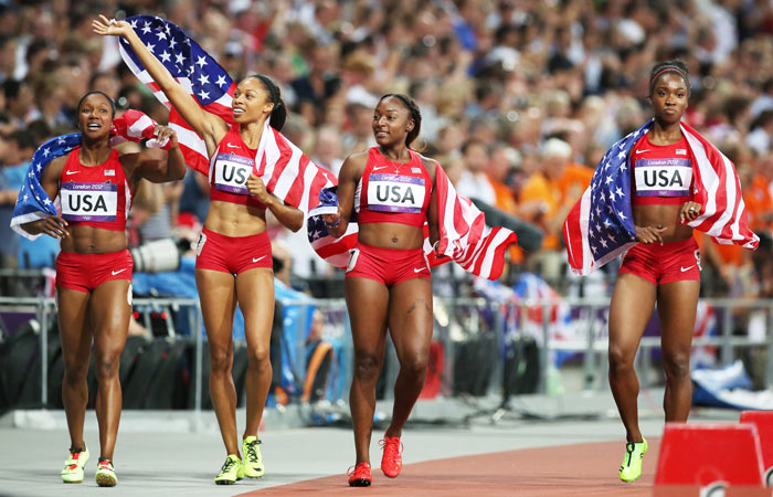 The USA's 4x100m Women's Relay team celebrate their gold – and their world record