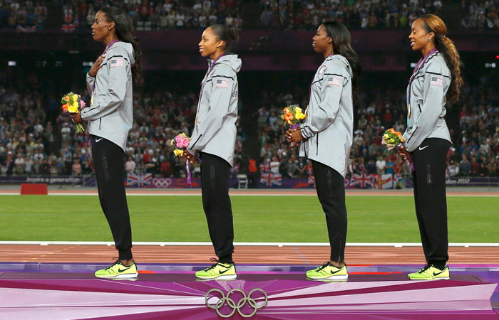 DeeDee Trotter, Allyson Felix, Francena McCorory and Sanya Richards-Ross listen to the anthem