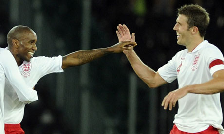 Michael Carrick (right), congratulates Jermain Defoe on his goal for England against Italy