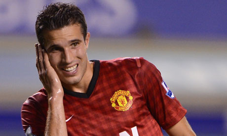 Humour: Robin van Persie manages to get hold of Arsène Wenger
