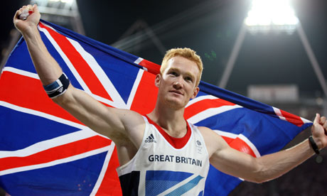 Greg Rutherford celebrates his gold medal for Great Britain in the long jump at the Olympics