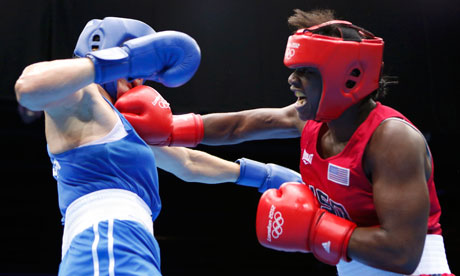 Claressa Shields of the US punches Russia's Nadezda Torlopova on her way to Olympic gold