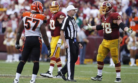 Washington Redskins left guard Kory Lichtensteiger argues with game referee Richard Nicks