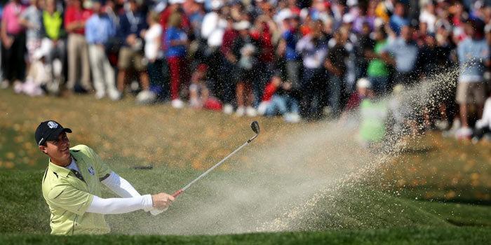 Nicolas Colsaerts of Europe watches his bunker shot on the 5th hole during the afternoon fourballs