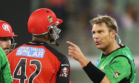Shane Warne, right, squares up to Marlon Samuels during the Big Bash Melbourne derby on Sunday