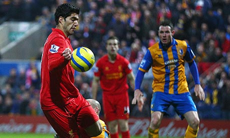 Liverpool's Luis Suárez handles the ball before scoring against Mansfield