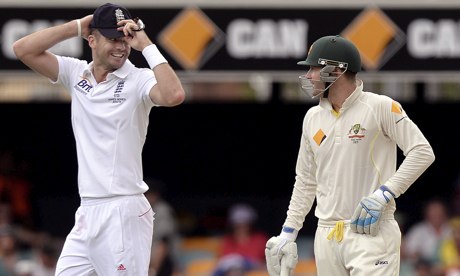 England's Jimmy Anderson, left, exchanges pleasantries with Australia captain Michael Clarke
