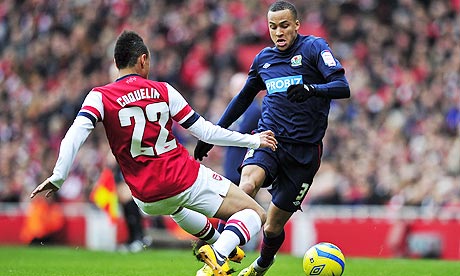 Blackburn Rovers' Martin Olsson, right, is tackled by Arsenal's Francis Coquelin in the FA Cup