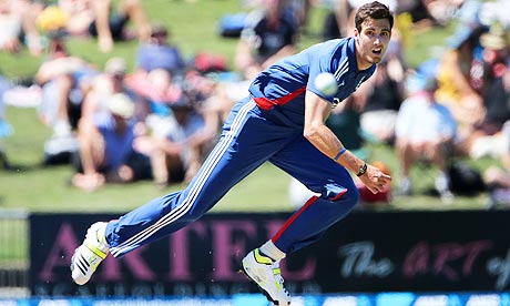 Steven Finn of England (R) bowls against