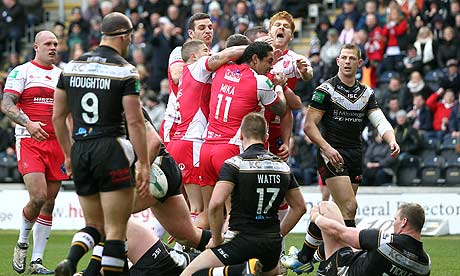 Hull Kingston Rovers players celebrate scoring against Hull FC
