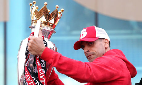 Manchester United's Rio Ferdinand with the Premier League Trophy