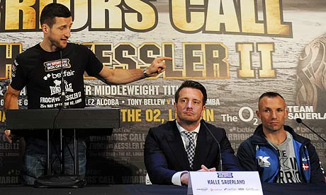 Carl Froch, left, gestures towards Mikkel Kessler, far right, and his promoter Kalle Sauerland.