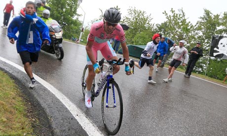 Vincenzo Nibali makes light of the wet conditions and the attendant John Terry fan to power to victo