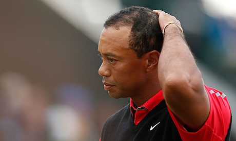 Tiger Woods reacts on the 18th green at The Open