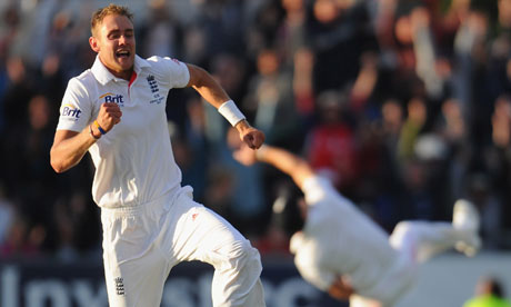 Stuart Broad celebrates while James Anderson throws the ball in the air (we think)