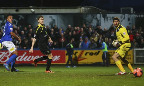 Macclesfield Town's Steve Williams, left, scores against Sheffield Wednesday in the FA Cup