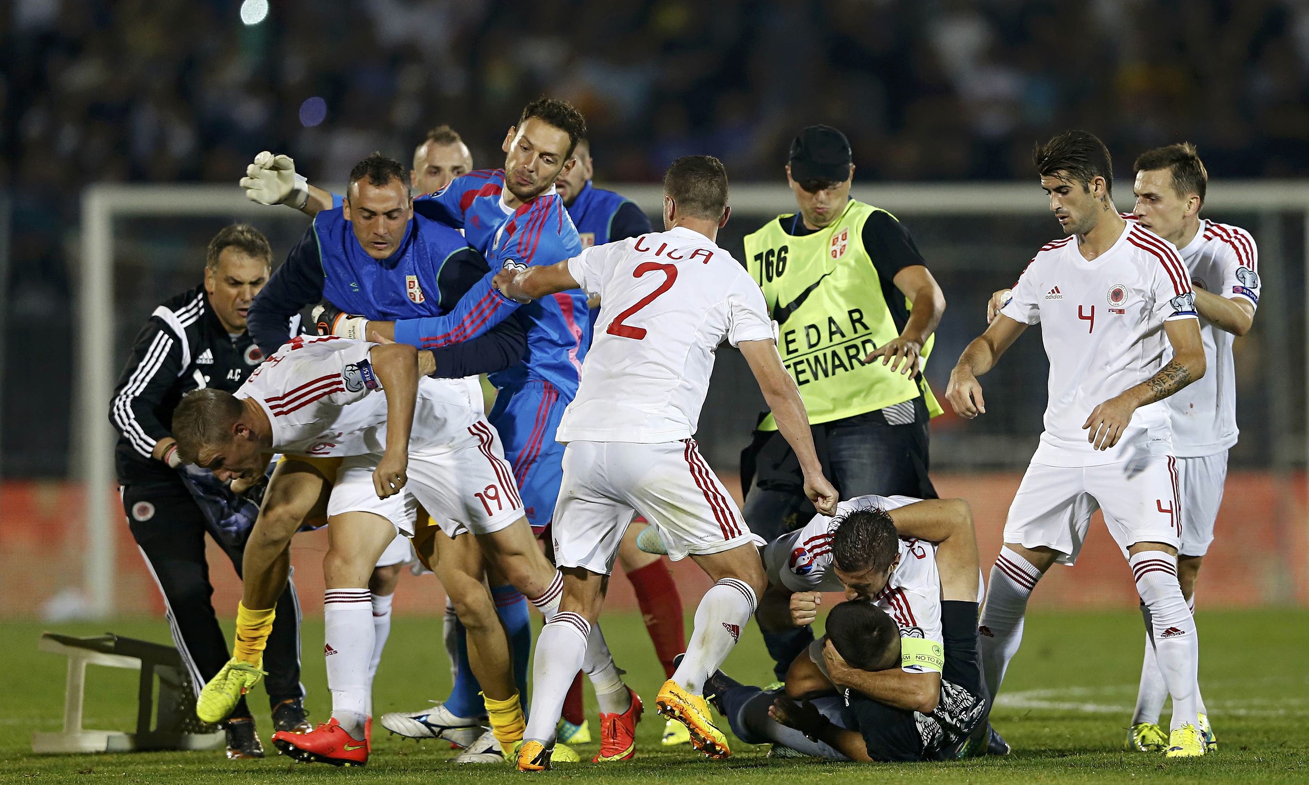 Serbia v Albania abandoned after players and fans brawl on pitch