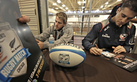 Tom Coolican, left, and Mike Petri sign autographs for students in Chicago